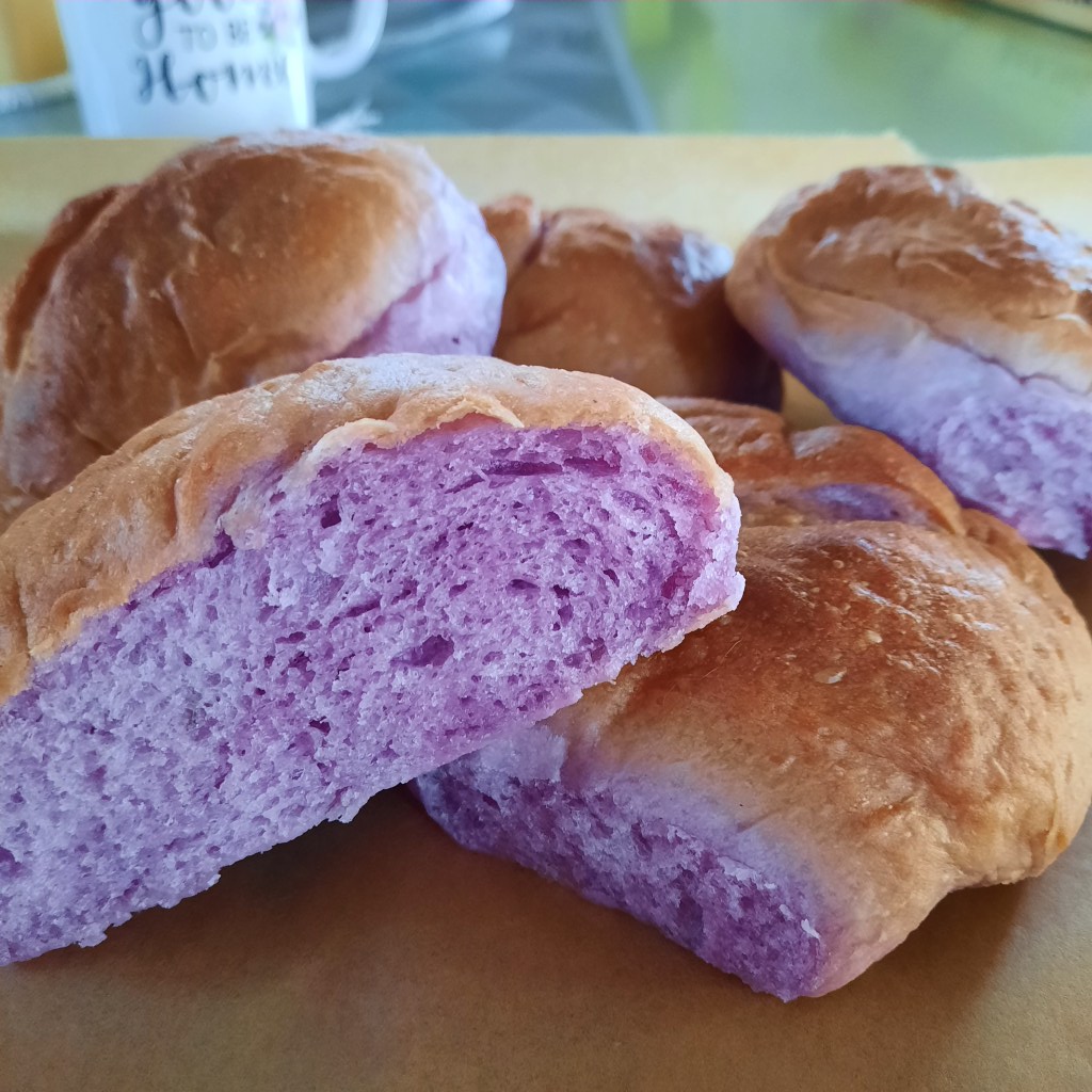 Ube halaya bread roll, cut in half