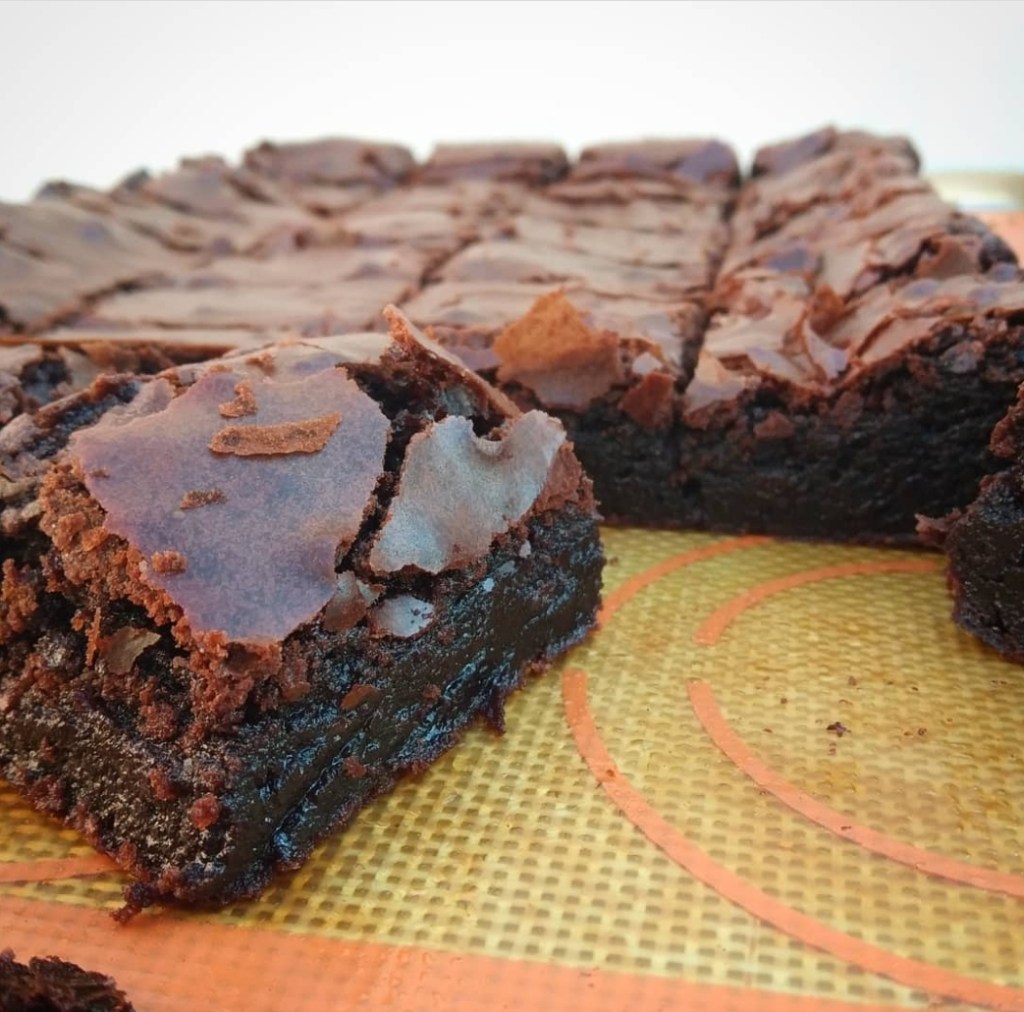 Sliced, brown sugar fudgy brownies on a tray.